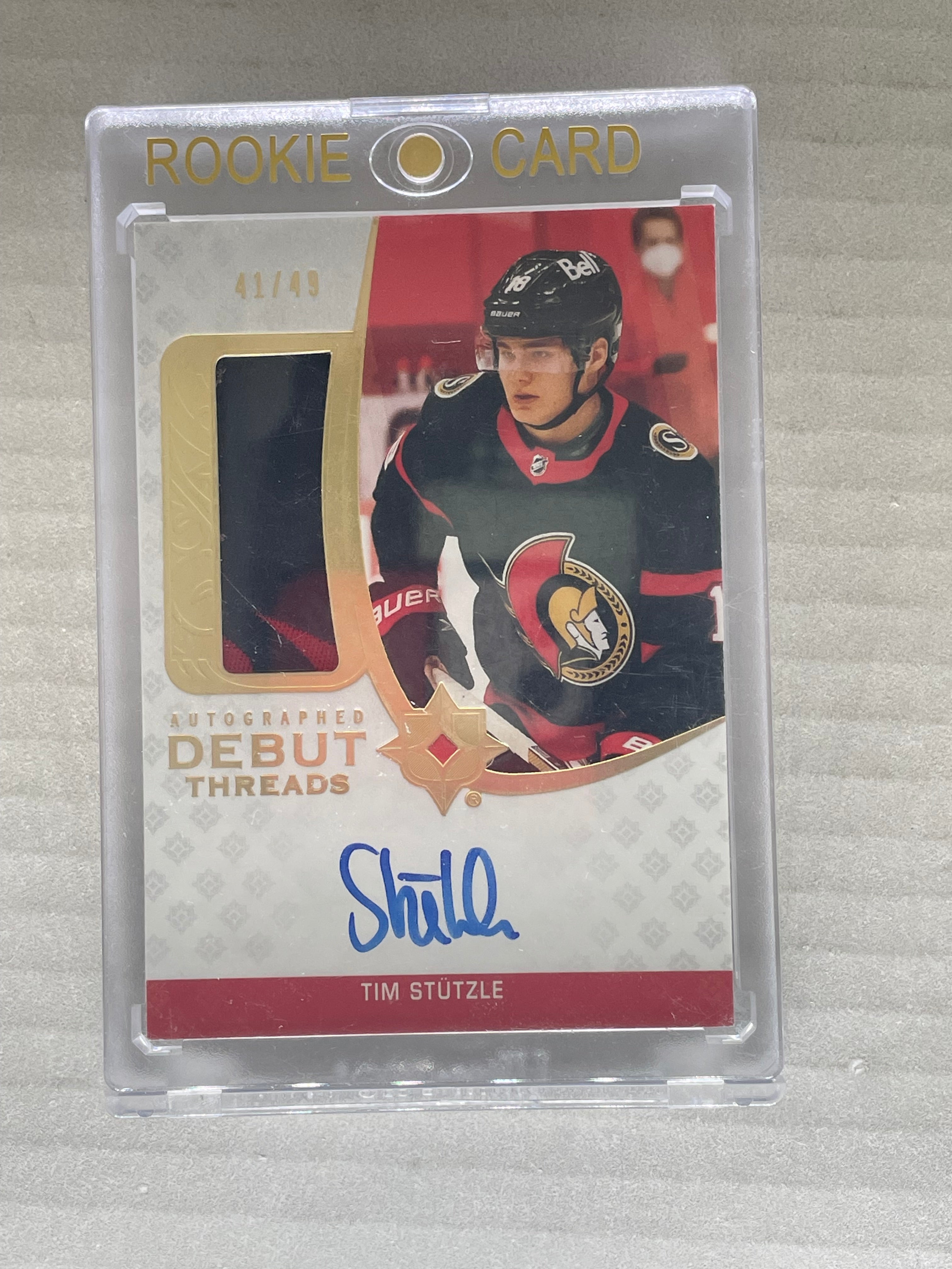 2020-21 Ultimate Collection Tim Stutzle Autographed Debut Threads /49