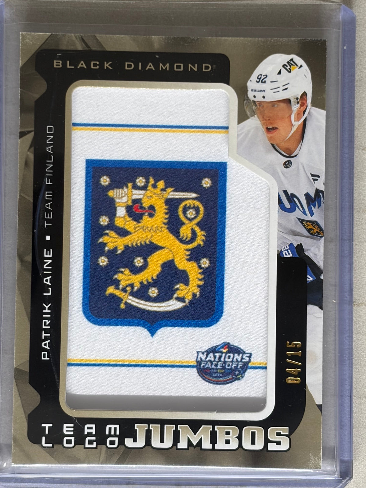2025-26 Black Diamond Gold Full Team Logo Jumbo Patch Finland Patrik Laine